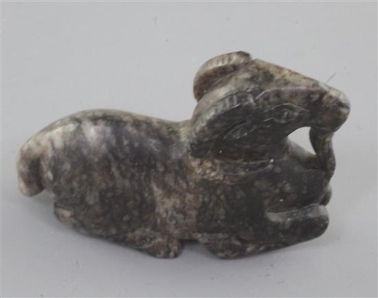 A Chinese grey and black mottled jade figure of a recumbent ram, 18th / 19th century, length 6cm